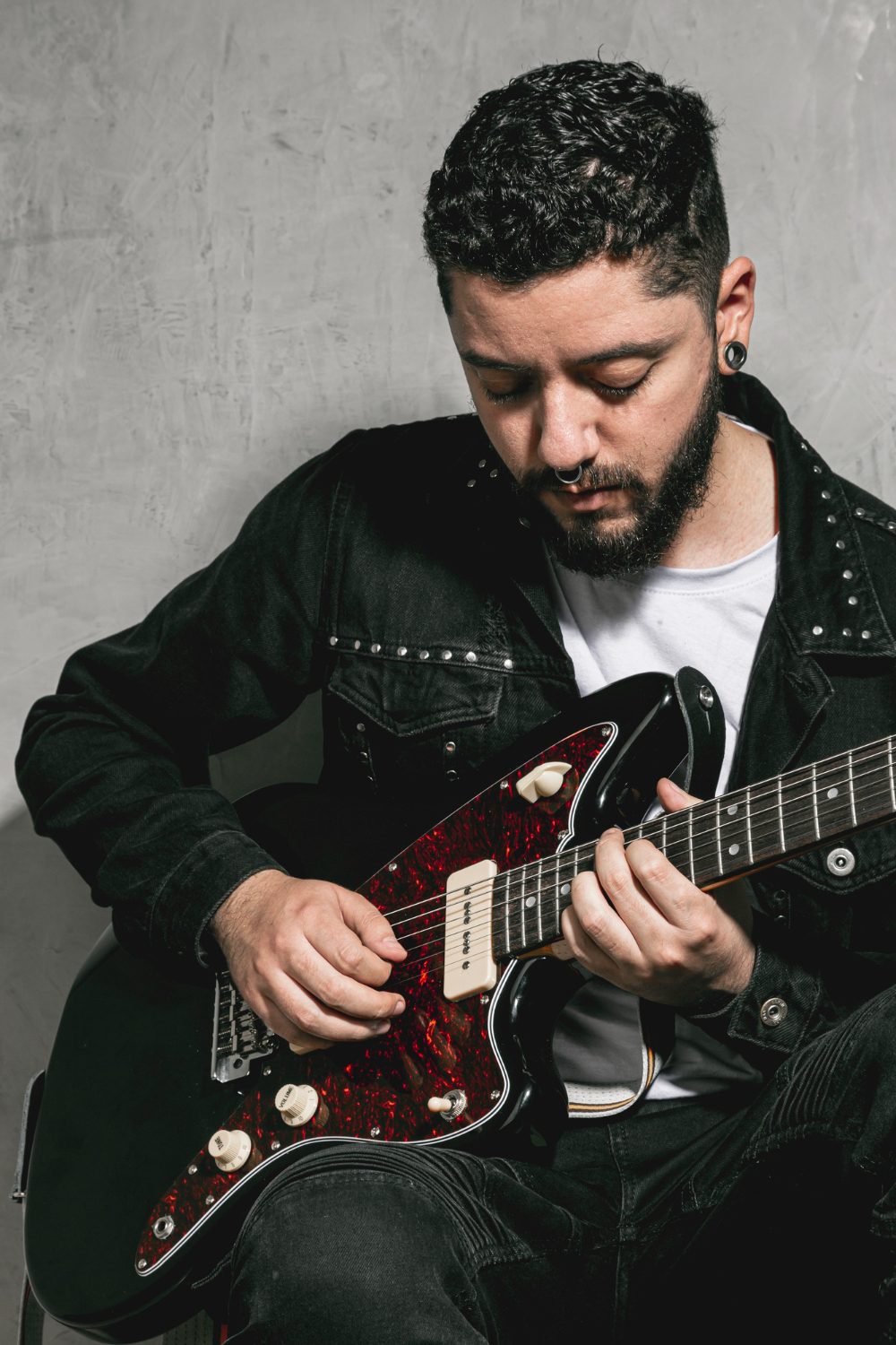stylish-rocker-playing-vintage-guitar